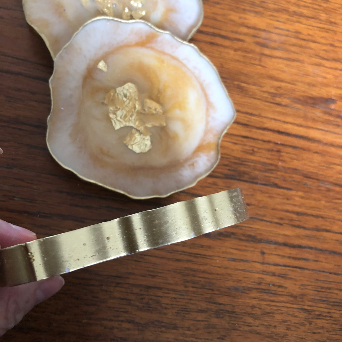 White and gold resin coasters